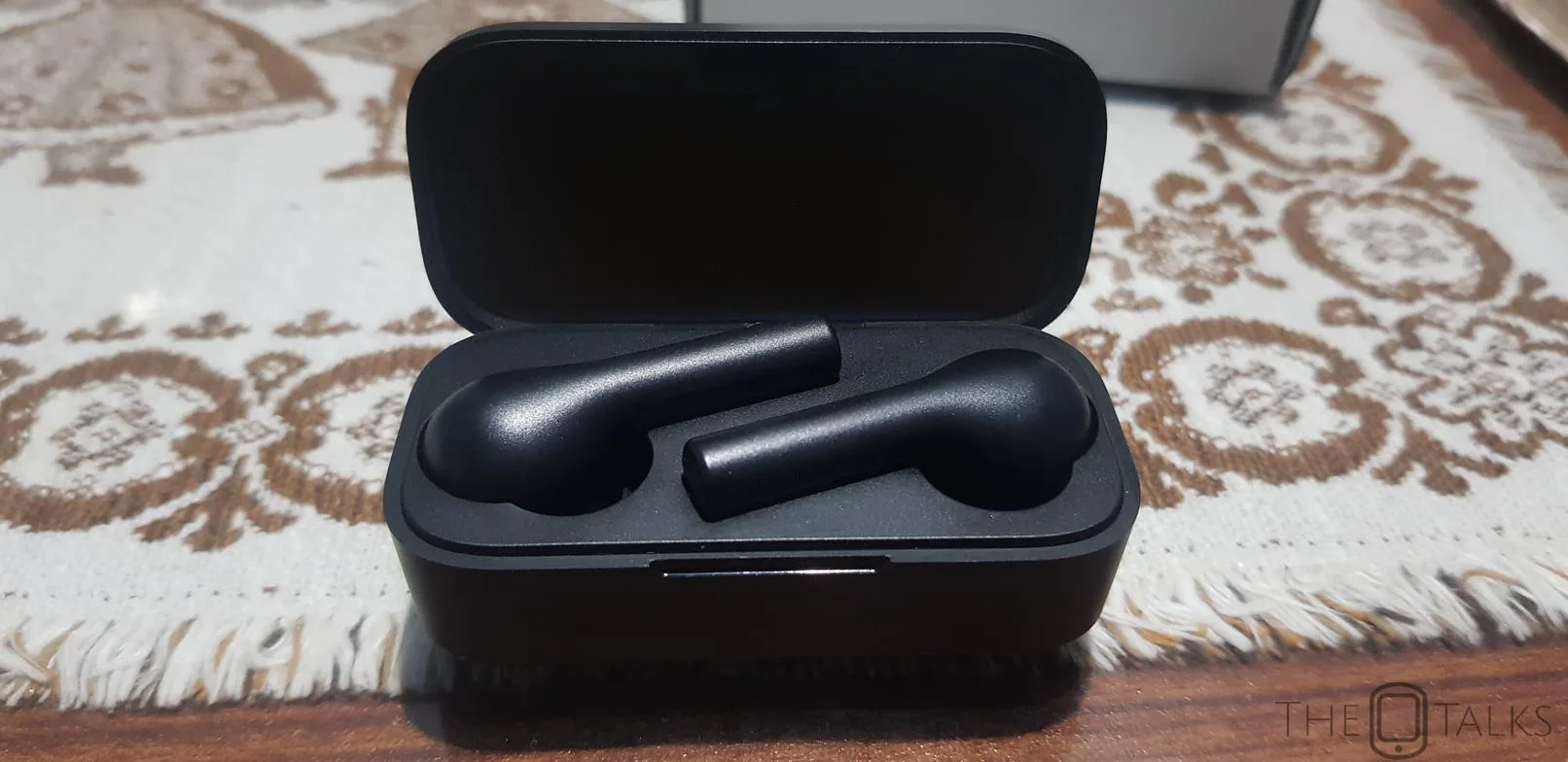 QCY T5 earbuds resting